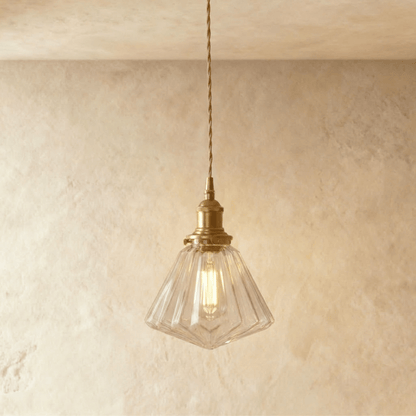 Residence Supply Isabel pendant light with a sleek metal frame and glass shade hanging from a ceiling mount.