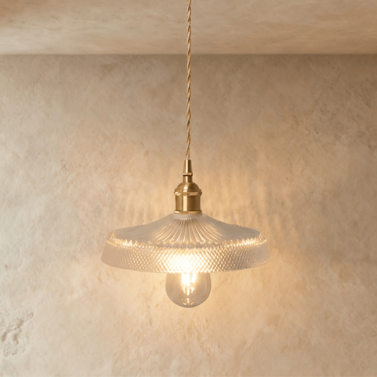 Modern Isabel Pendant Light by Residence Supply with a sleek metal finish and stylish design, hanging from a ceiling fixture.