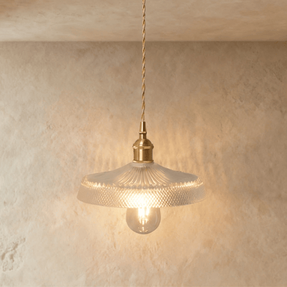 Modern Isabel Pendant Light by Residence Supply with a sleek metal finish and stylish design, hanging from a ceiling fixture.