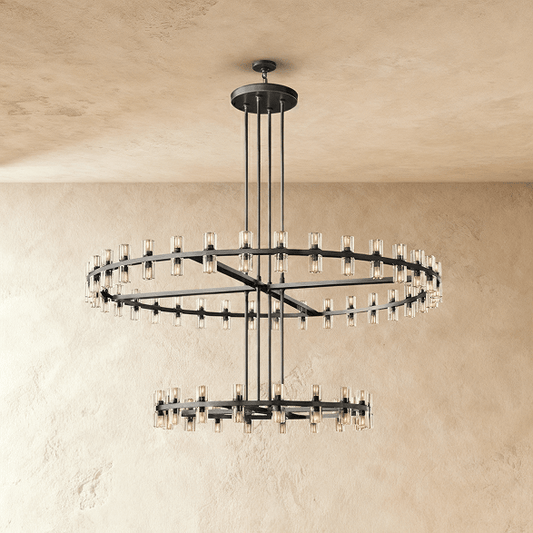 Elegant Istu Chandelier by Residence Supply with multiple crystal tiers and gold finish, hanging from a ceiling mount.