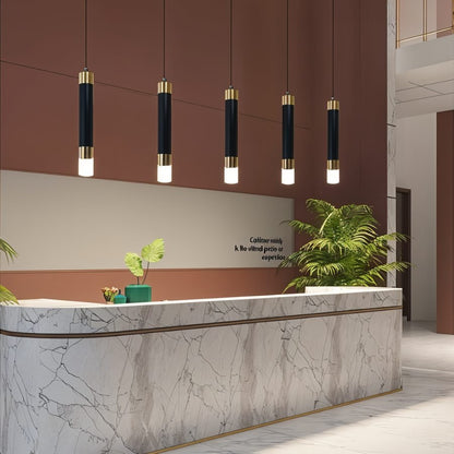 Ivanna Pendant Light by Residence Supply hanging from ceiling with a modern design and clear glass shade.