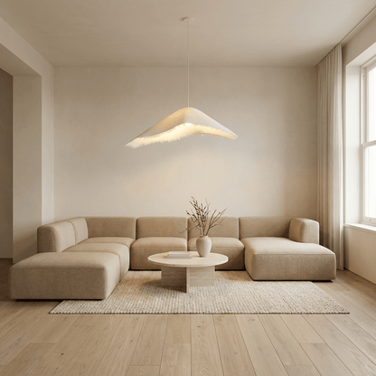 Jairo Pendant Light by Residence Supply hanging with a sleek modern design and warm lighting in a contemporary setting