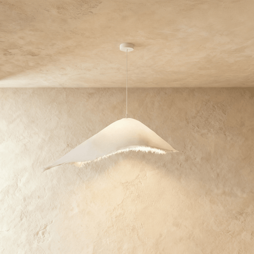 Modern Jairo Pendant Light by Residence Supply with sleek metal finish hanging from a ceiling fixture.