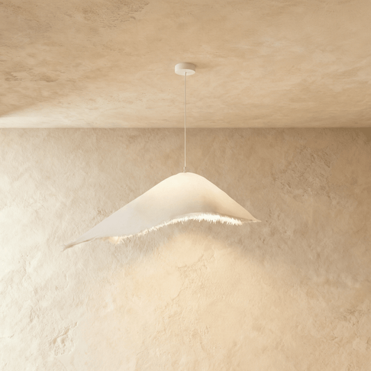 Modern Jairo Pendant Light by Residence Supply with sleek metal finish hanging from a ceiling fixture.