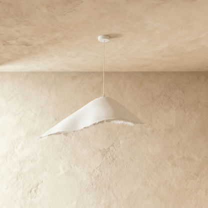 Jairo pendant light by Residence Supply featuring a sleek, modern design with a metal shade and hanging cord for stylish lighting.