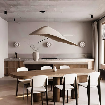 Jairo Pendant Light by Residence Supply hanging from ceiling with a modern design and warm ambient lighting.
