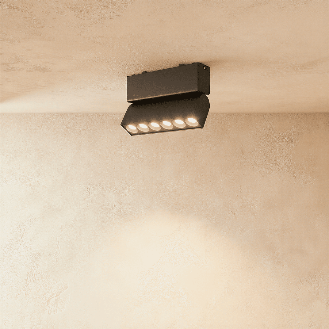 Modern Janae Track Light System by Residence Supply with adjustable spotlights mounted on a sleek black track.