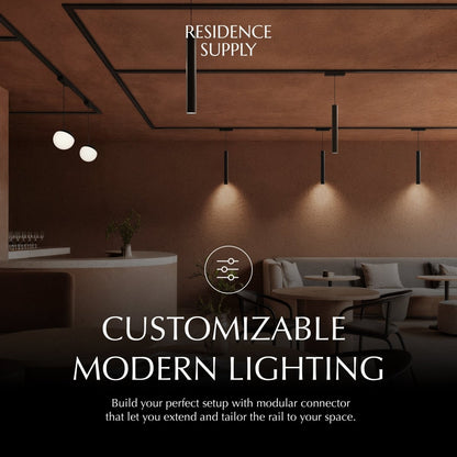Modern Janae Track Light System by Residence Supply featuring adjustable spotlights on a sleek metal track.