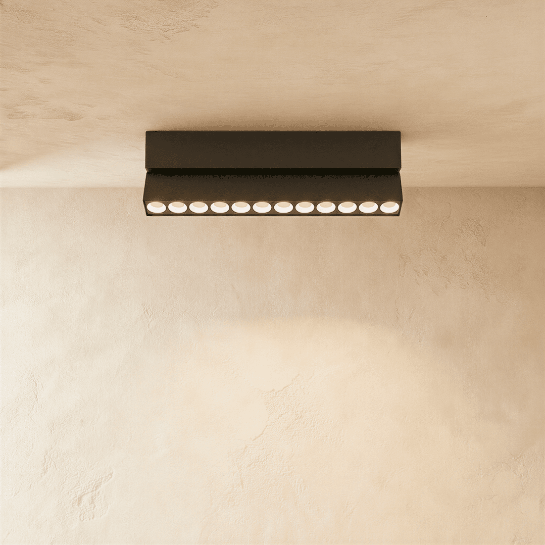 Modern Janae Track Light System by Residence Supply with adjustable spotlights mounted on a sleek metal track.