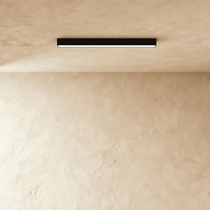 Modern Janae Track Light System by Residence Supply with adjustable spotlights on a sleek metal track.