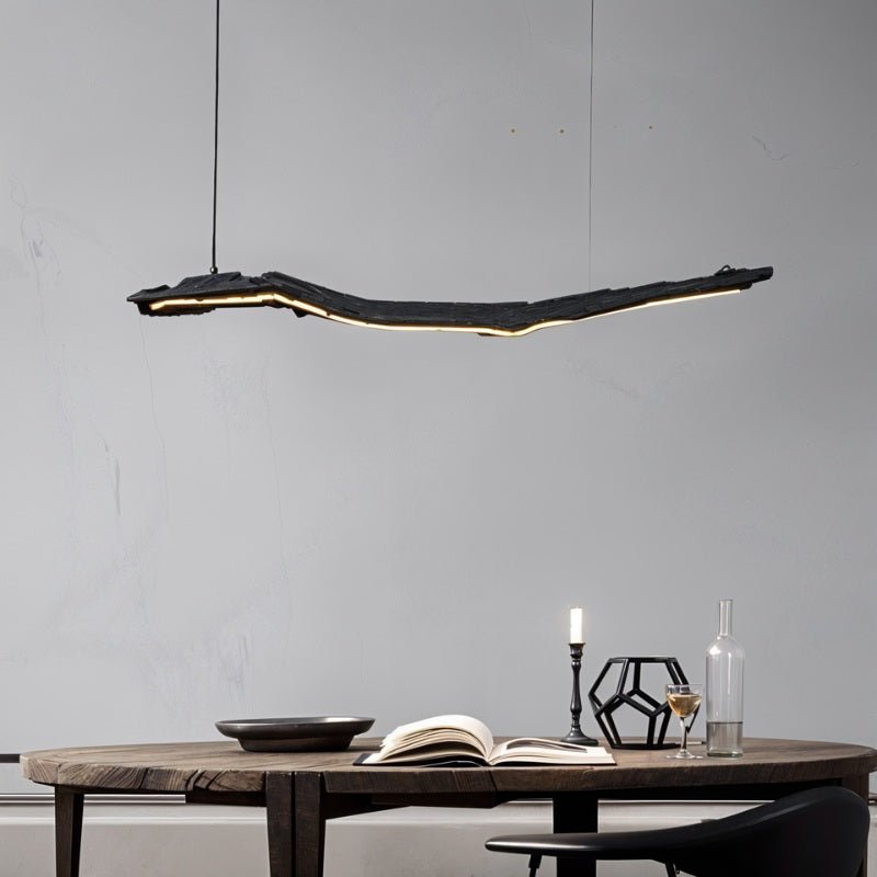 Modern Jennet Pendant Light by Residence Supply with sleek metal finish and adjustable cord hanging from ceiling fixture.