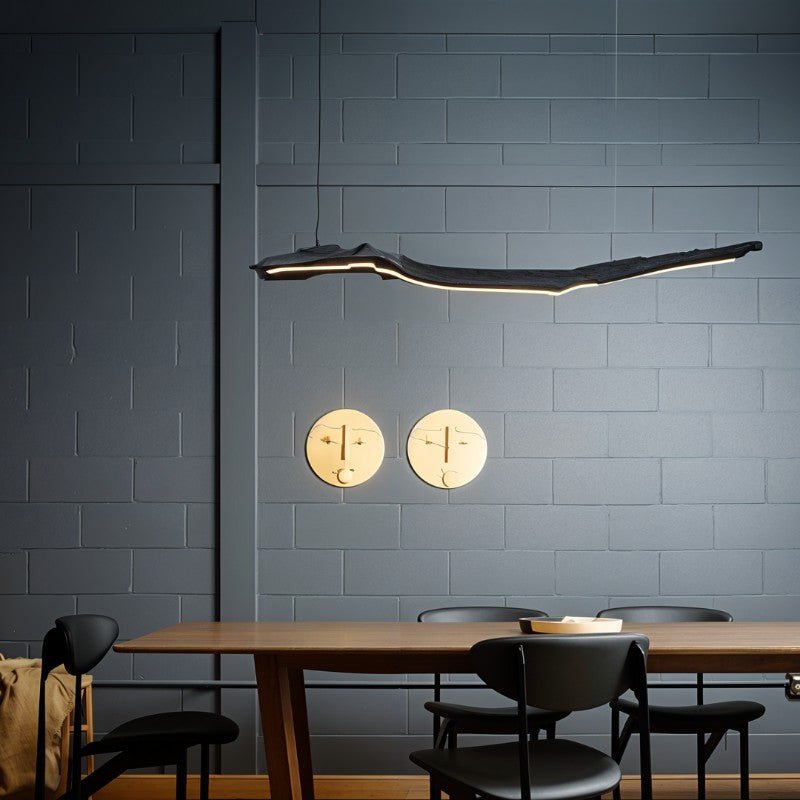 Jennet Pendant Light by Residence Supply hanging from ceiling with a sleek modern design and clear glass shade.