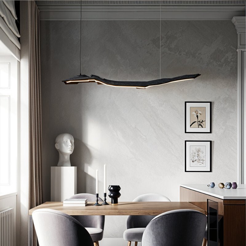 Jennet Pendant Light by Residence Supply hanging from ceiling with a sleek modern design and warm lighting.