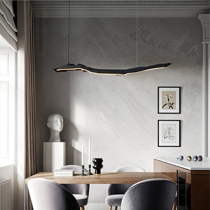 Jennet Pendant Light by Residence Supply hanging from ceiling with a sleek modern design and warm lighting.