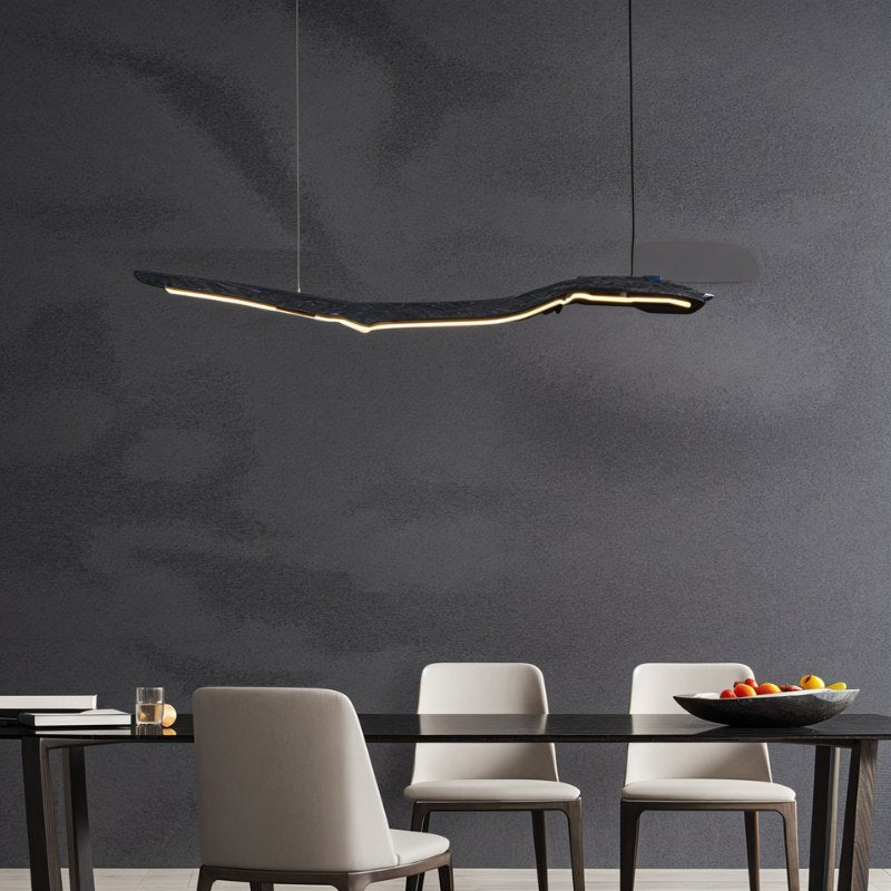 Jennet Pendant Light by Residence Supply hanging from ceiling with a modern design and clear glass shade in a stylish interior setting.