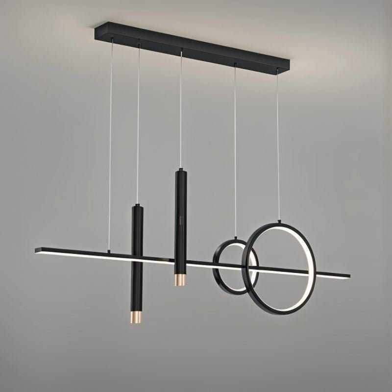 Joffrey Pendant Light by Residence Supply hanging from ceiling with a modern design and clear glass shade.