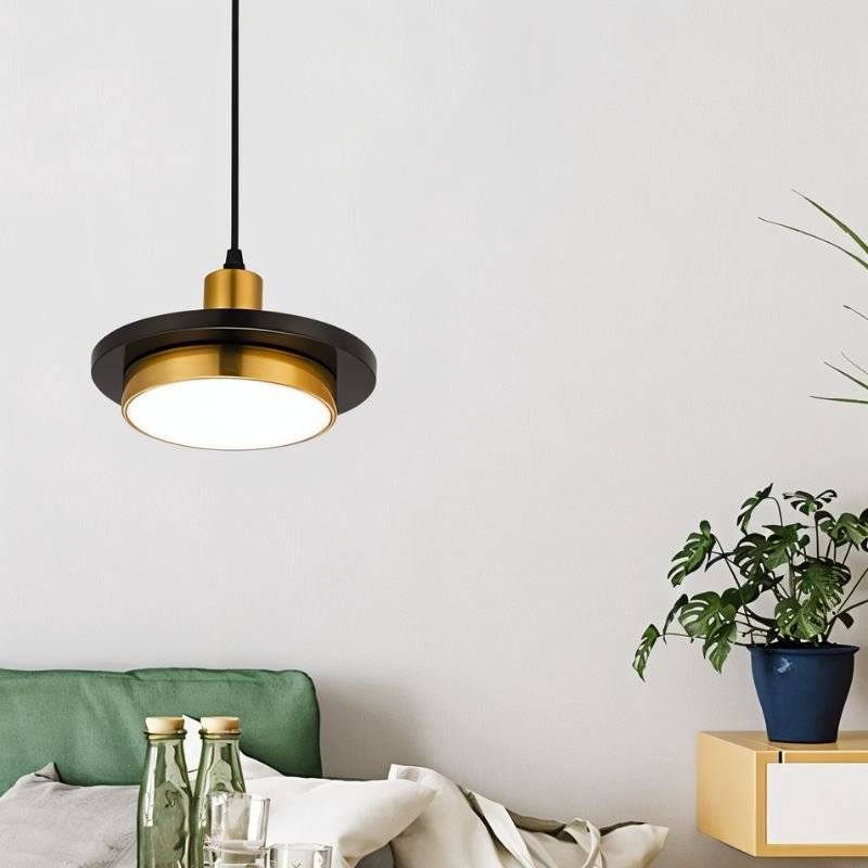 Julian Pendant Light by Residence Supply hanging from ceiling with a modern design and clear glass shade.