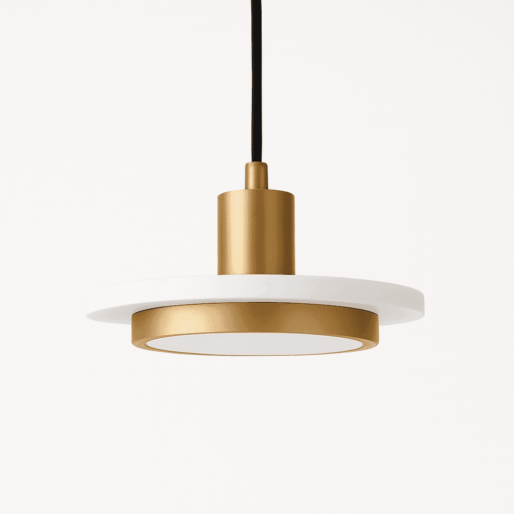 Julian Pendant Light from Residence Supply hanging with a sleek, modern design and a warm metallic finish.