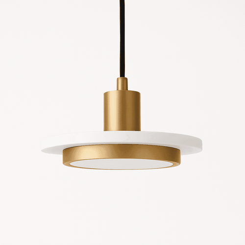 Julian Pendant Light from Residence Supply hanging with a sleek, modern design and a warm metallic finish.