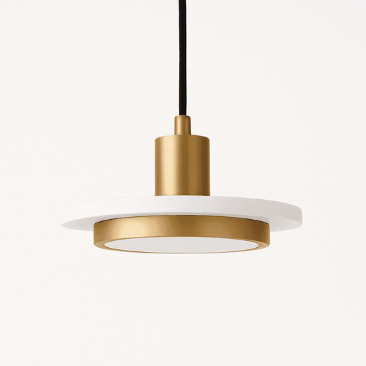 Julian Pendant Light from Residence Supply hanging with a sleek, modern design and a warm metallic finish.