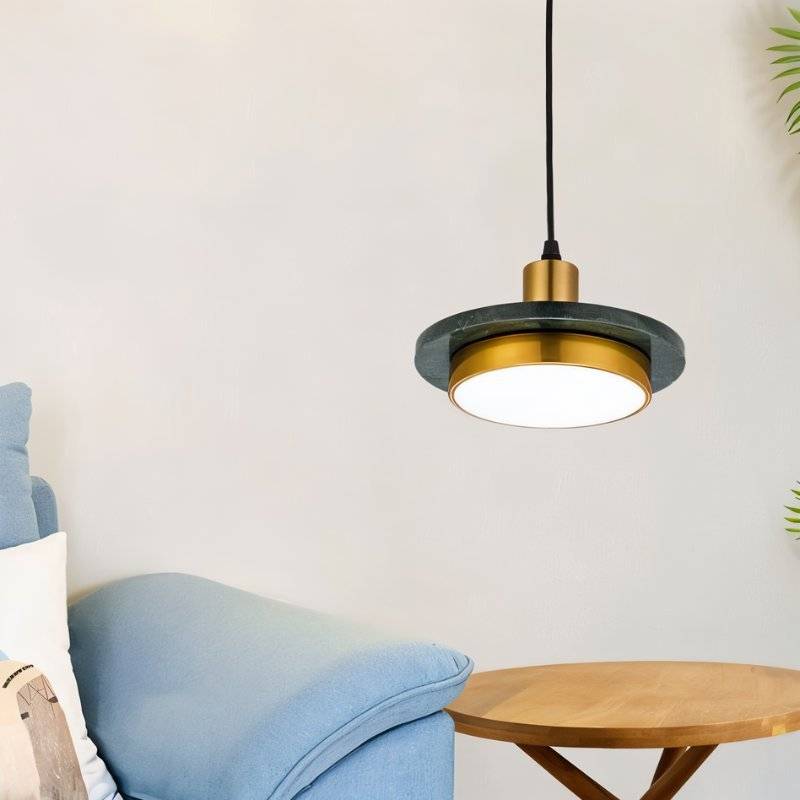Julian Pendant Light by Residence Supply hanging from ceiling with a modern, sleek design and warm lighting.