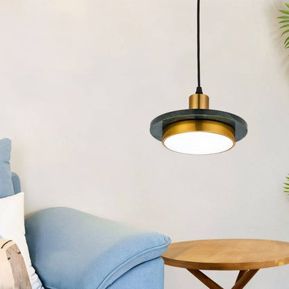 Julian Pendant Light by Residence Supply hanging from ceiling with a modern, sleek design and warm lighting.