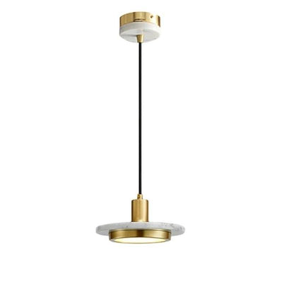 Julian Pendant Light by Residence Supply hanging with a modern design and warm lighting in a contemporary interior setting.