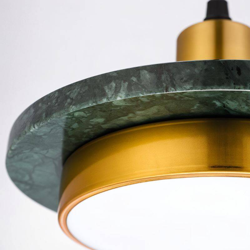 Julian Pendant Light by Residence Supply hanging from ceiling with a modern design and exposed bulb in a contemporary interior.