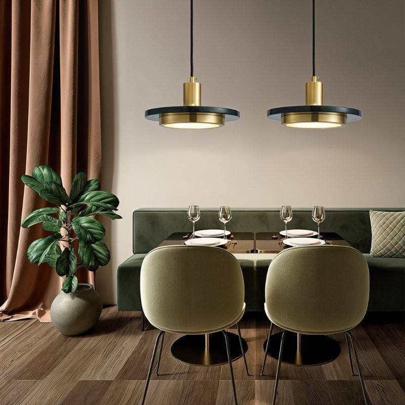 Julian Pendant Light by Residence Supply hanging from ceiling with a sleek, modern design and warm ambient lighting.