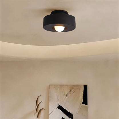 Black Julish Ceiling Light by Residence Supply installed in a room, showcasing modern design and ceiling mounting.