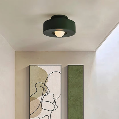 Green Julish ceiling light fixture from Residence Supply, shown installed in a hallway with a modern design.