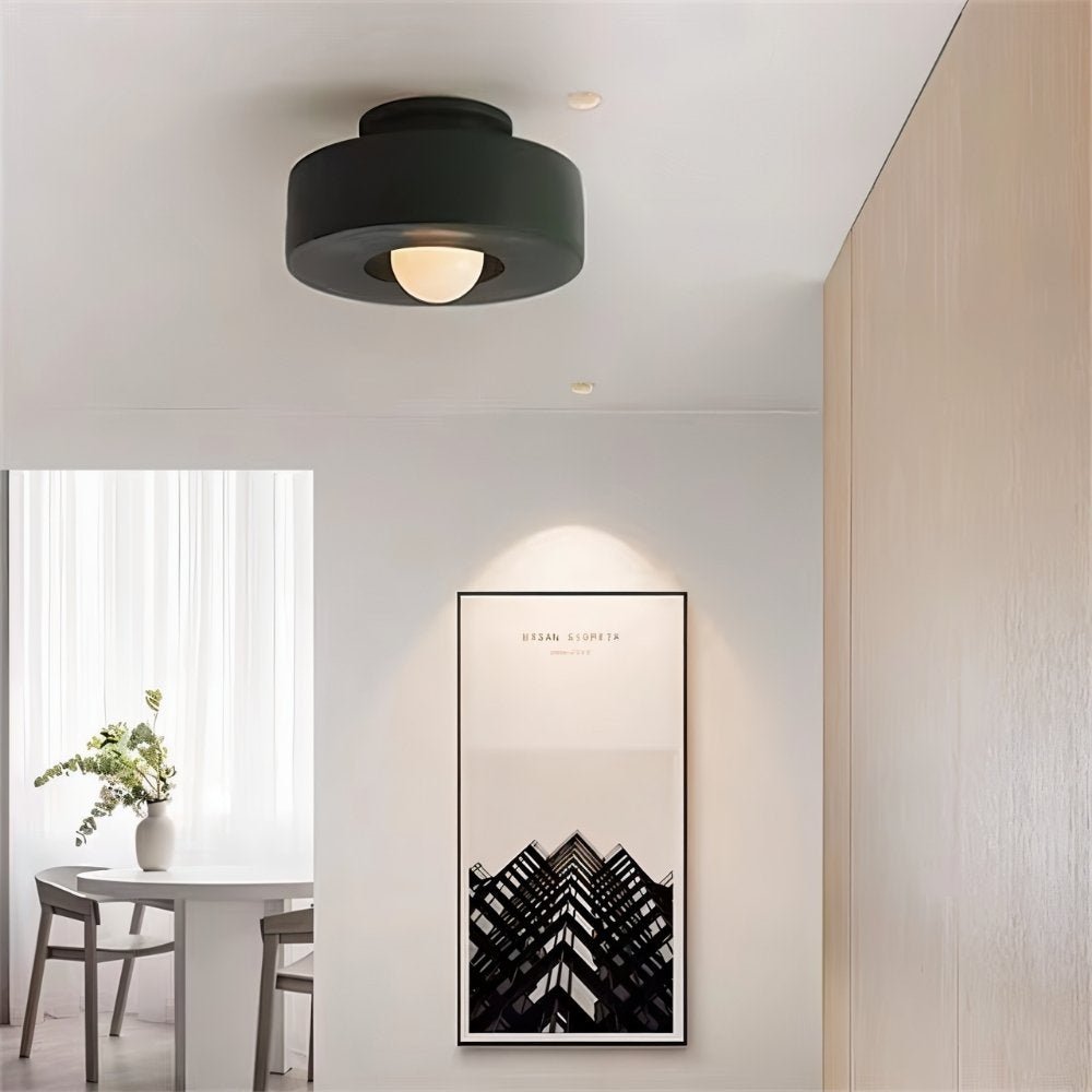 Green Julish Ceiling Light by Residence Supply installed in a room, showcasing modern design and bright illumination.
