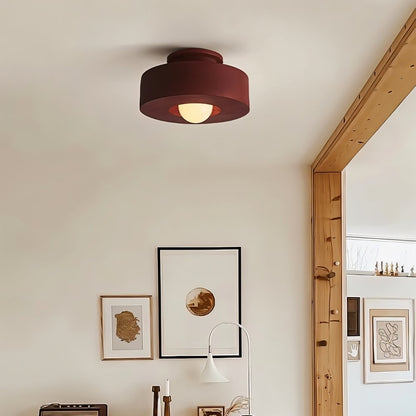 Red Julish ceiling light fixture installed in a room, showcasing modern design and home lighting from Residence Supply.