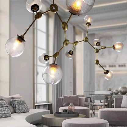 Elegant Jyotish indoor chandelier by Residence Supply with intricate design and warm lighting for stylish home illumination.