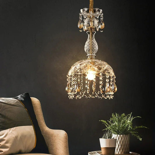 Modern Kajani pendant light by Residence Supply hanging from ceiling with warm ambient lighting and sleek design.