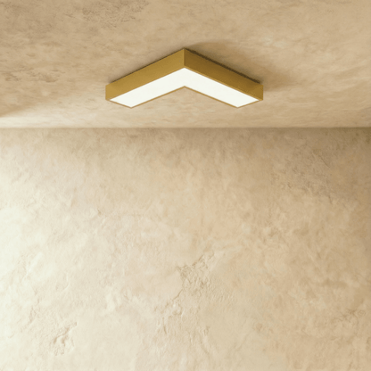 Korner ceiling light by Residence Supply, modern round fixture with sleek design and white finish, mounted on a ceiling.