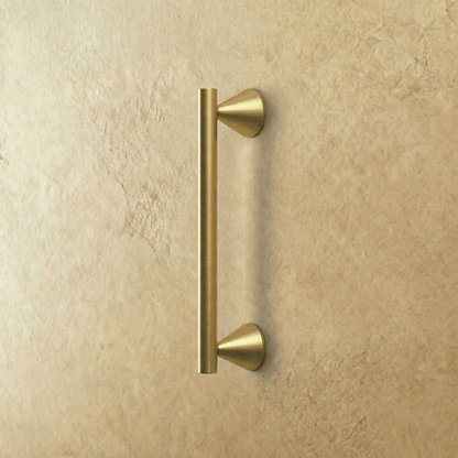 Crystal knob and pull bar from Residence Supply, shown on a cabinet door with a sleek, transparent glass finish.