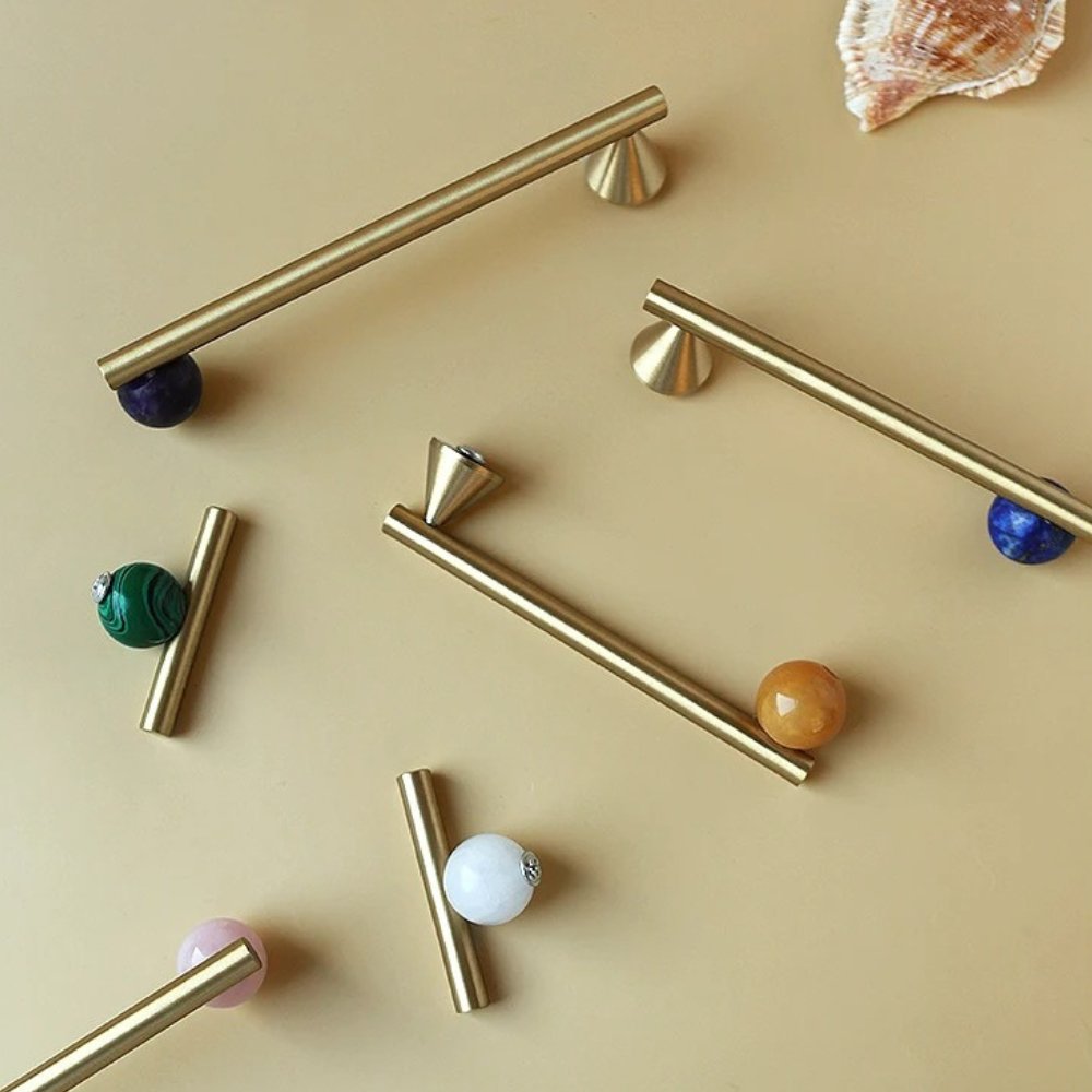 Crystal knob and pull bar from Kwam, made of clear glass, designed for cabinet hardware in home and garden interiors.