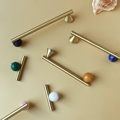 Crystal knob and pull bar from Kwam, made of clear glass, designed for cabinet hardware in home and garden interiors.