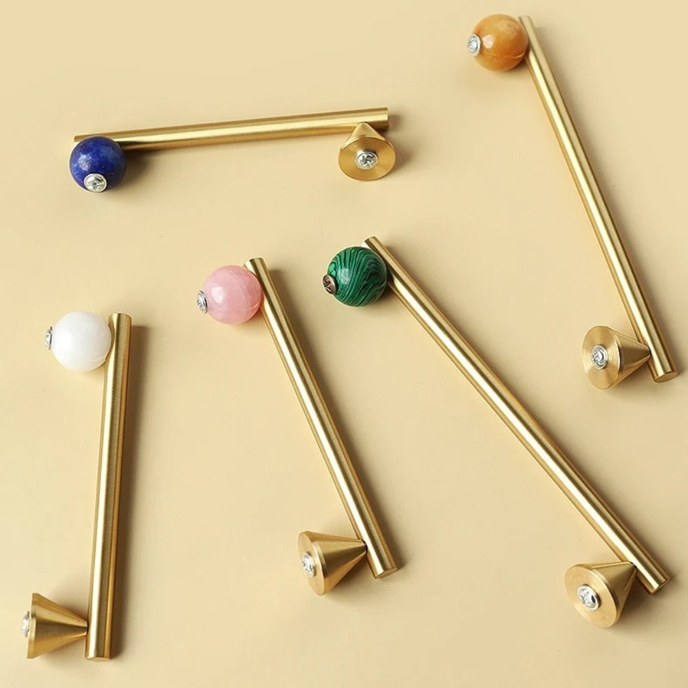Crystal knob and pull bar from Kwam, made of clear glass, designed for cabinet hardware in home and garden decor.