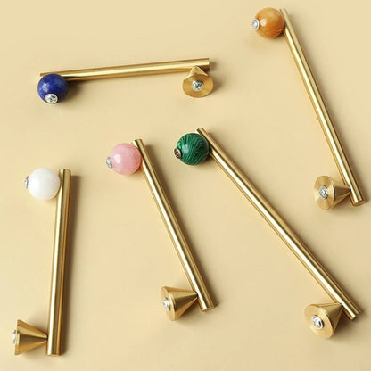 Crystal knob and pull bar from Kwam, made of clear glass, designed for cabinet hardware in home and garden decor.