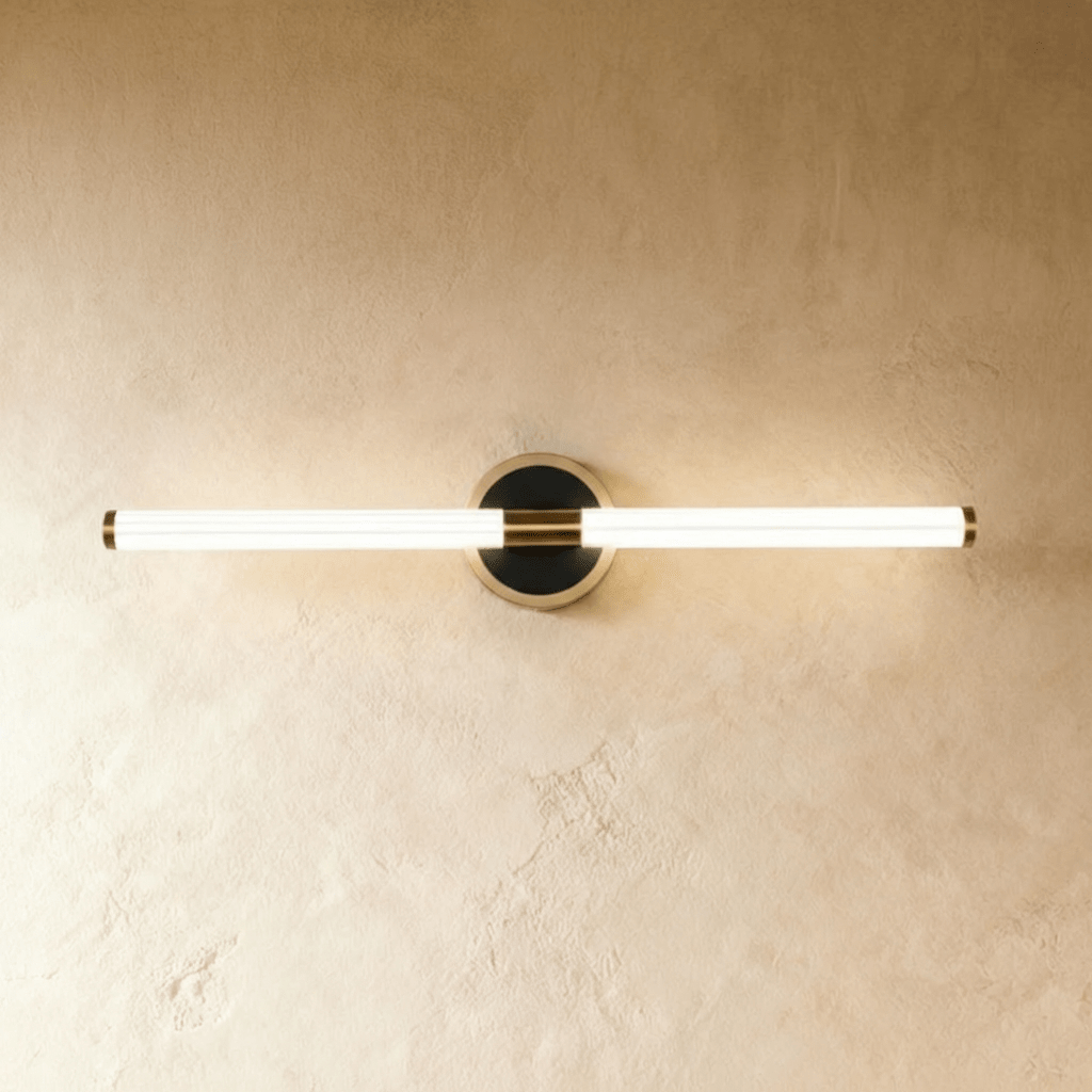 Lacto Wall Lamp by Residence Supply featuring a sleek, modern design with a curved metal arm and minimalist shade.