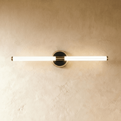 Lacto Wall Lamp by Residence Supply featuring a sleek, modern design with a curved metal arm and minimalist shade.