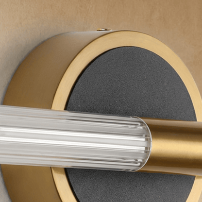 Lacto Wall Lamp by Residence Supply featuring a sleek, modern design with a curved metal arm and cylindrical shade for ambient lighting.