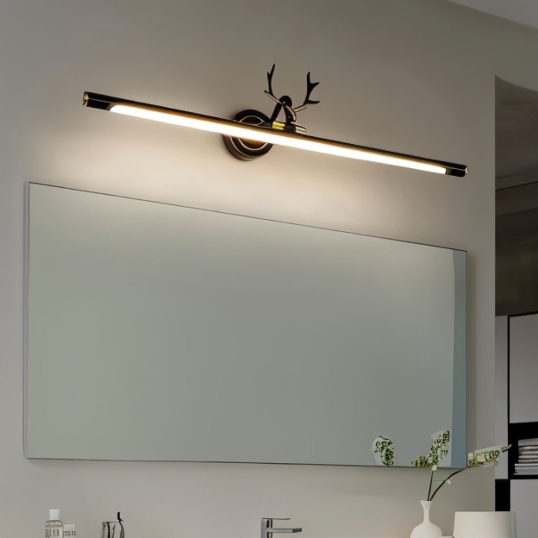 Modern Leios Wall Lamp by Residence Supply mounted on a white wall, featuring a sleek, minimalist design with a curved metal arm.