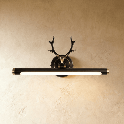 Modern Leios Wall Lamp by Residence Supply featuring a sleek design with a curved arm and cylindrical shade mounted on the wall.