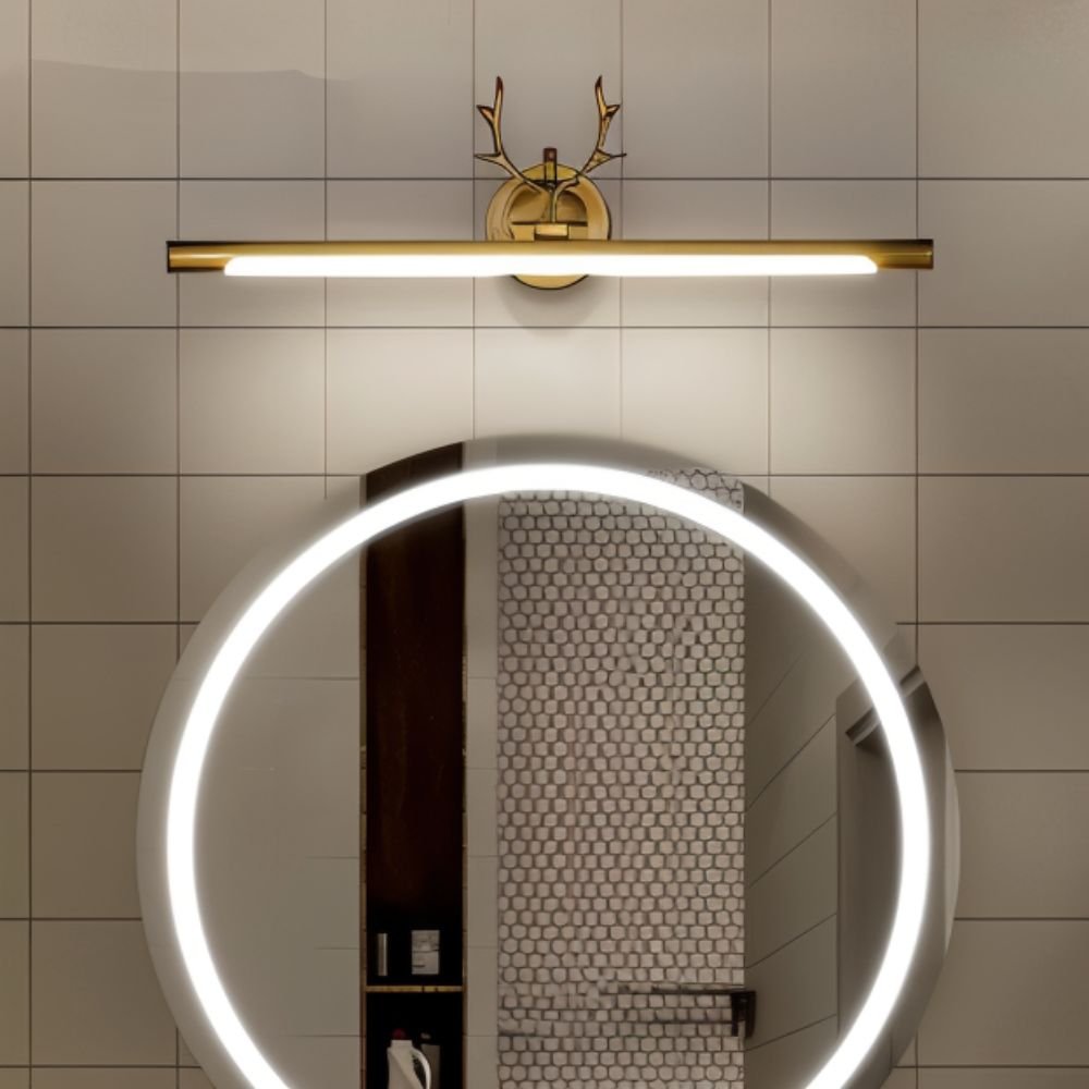 Leios Wall Lamp by Residence Supply mounted on a wall, featuring a sleek modern design with a cylindrical shade and metal finish.