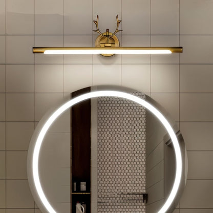 Leios Wall Lamp by Residence Supply mounted on a wall, featuring a sleek modern design with a cylindrical shade and metal finish.