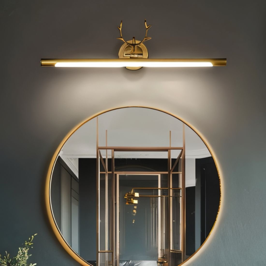 Leios wall lamp by Residence Supply featuring a modern design with a sleek metal finish and adjustable arm, mounted on a white wall.