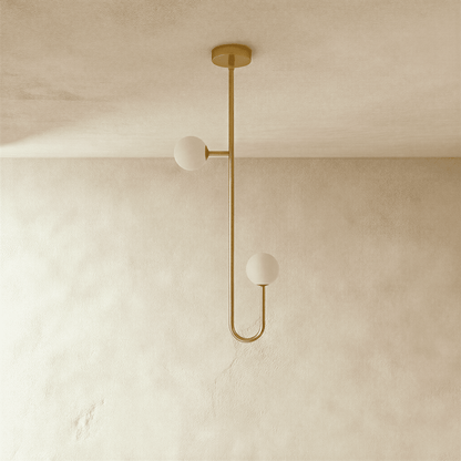 Lexto Indoor Chandelier by Residence Supply with multiple glass globes and modern design, hanging from a ceiling fixture.